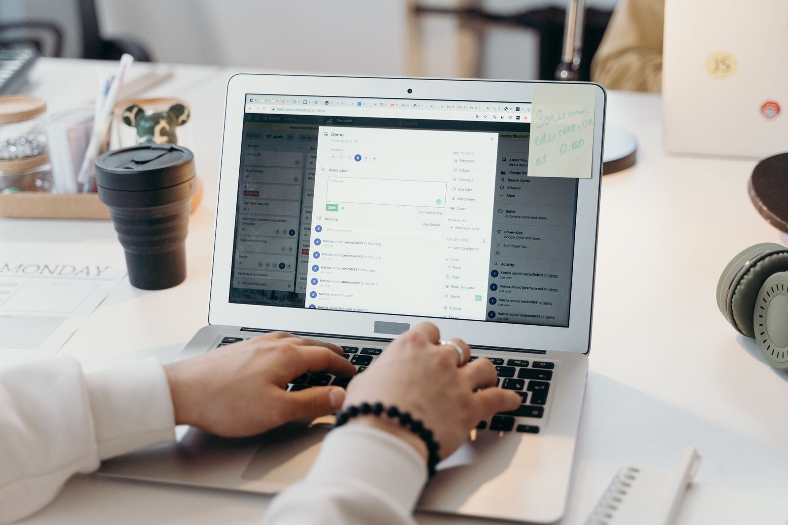 Hands typing on a laptop with an email inbox open, the daily work of email marketing for travel agents